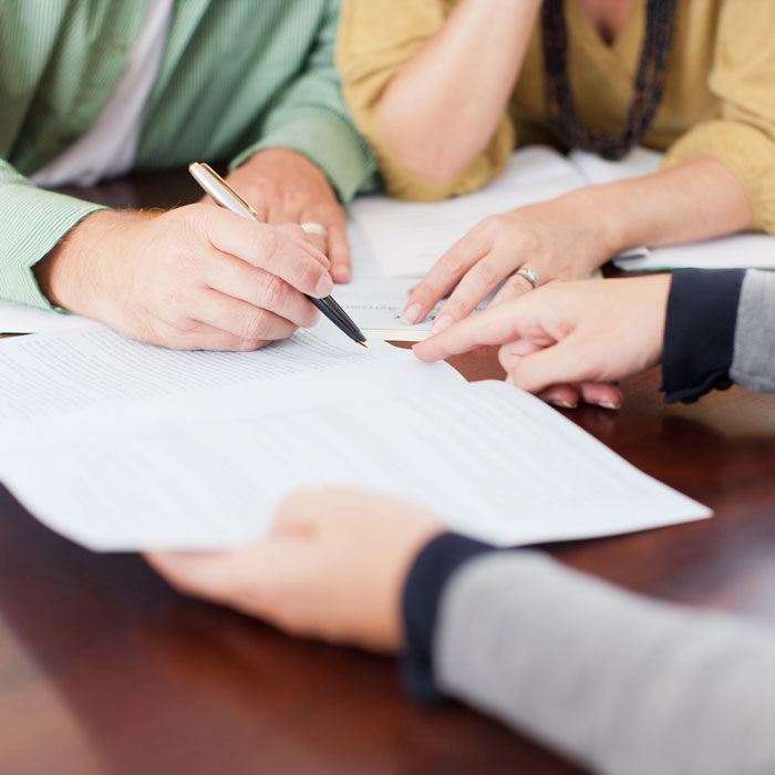 Couple going over documents with agent